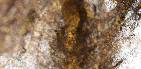 Abstract gold and white glitter texture. Perfect for festive designs.