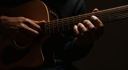 Obraz premium Close-Up of Man Playing Acoustic Guitar: Expressing Musical Artistry Through Performance, Passion, Skill, and Precision in Music Composition and Entertainment with String Instrument