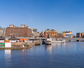 Historic waterfront with ferries and city buildings in Stockholm
