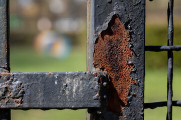 Detailed CloseUp View of a Rusty and Weathered Metal Gate with Interesting Textures