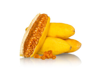 Vibrant taxo fruit display: whole yellow fruits with one cut open revealing a bright orange jelly interior full of seeds. Ideal for recipes, juices and menus