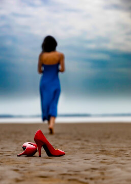 young woman walking on the beach