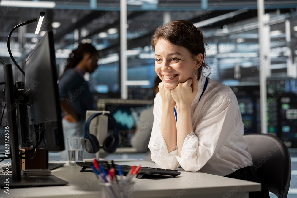 Poster jolly engineer in server hub satisfied by improved system efficiency metrics. cheerful woman working
