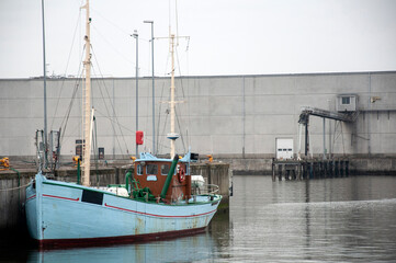 old wooden fishing boat docked in harbour