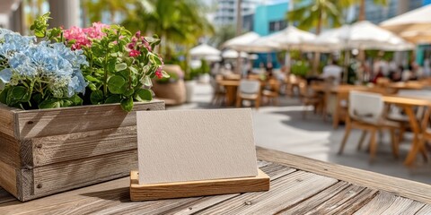 Blank White Card on Wooden Stand at Outdoor Cafe for Menu or Branding Mockup