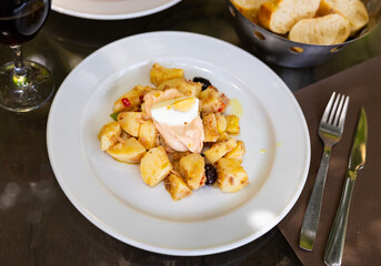 Appetizing rustic salad with tuna, egg and potatoes served on platter