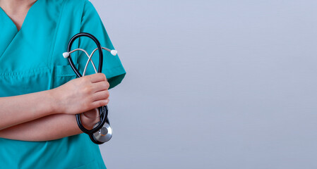 doctor woman holding a stethoscope at clinic
