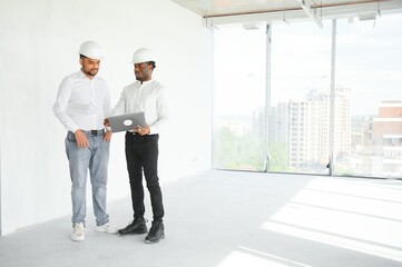Group of multi ethnic engineer construction site worker meeting at workplace