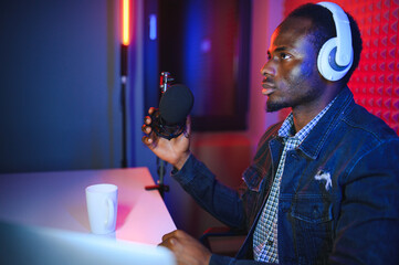 African american video blogger records content in his studio.