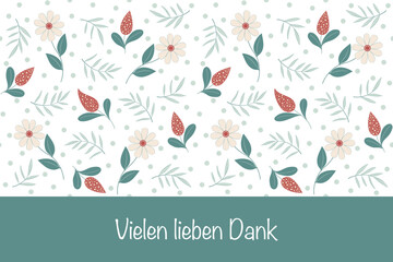 Vielen lieben Dank - Schriftzug in deutscher Sprache. Grußkarte mit einem Blumenmuster.