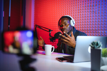 African american video blogger records content in his studio.