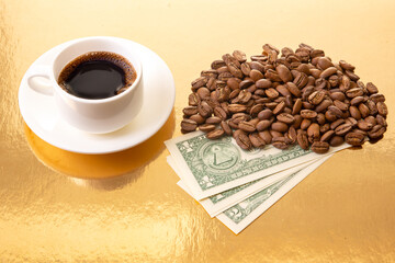 A close-up of a white ceramic cup filled with rich Turkish coffee, surrounded by roasted coffee...