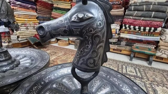 Damascene craftsmanship, a traditional art form from Meknes, Morocco, featuring intricate metalwork with gold or silver inlays, showcasing the region&rsquo;s rich artisanal heritage and meticulous detail.