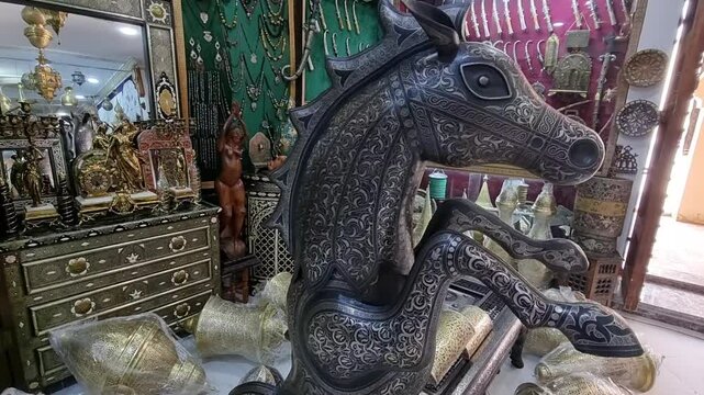 Damascene craftsmanship, a traditional art form from Meknes, Morocco, featuring intricate metalwork with gold or silver inlays, showcasing the region&rsquo;s rich artisanal heritage and meticulous detail.