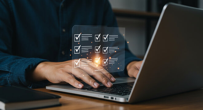 A person using a laptop with a digital checklist overlayed on the screen and keyboard area view close up