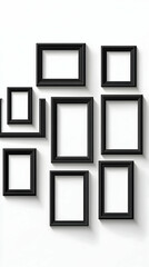 Black picture frames on a white wall