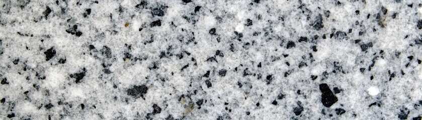 Close up view of speckled gray stone surface.