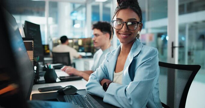 Arms crossed, face and smile of programmer woman at desk in office as graphic designer for software development. Coding, computer and web design with happy developer or engineer at night for update