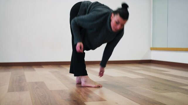 Ballerina's Feet Move On Parquet Floor During Classical Dance Warm Up Indoor