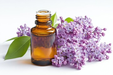 Lilac essential oil in a brown bottle, surrounded by fresh lilac blossoms