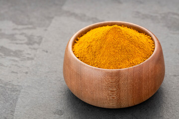 Organic turmeric powder in the bowl - Curcuma longa