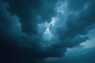 Obraz premium Ominous, dark storm clouds gather overhead, heavy with rain , cloud formations, abstract