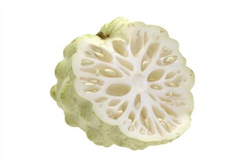 Close-up of a lotus root slice, showcasing its unique honeycomb structure and pale green exterior.