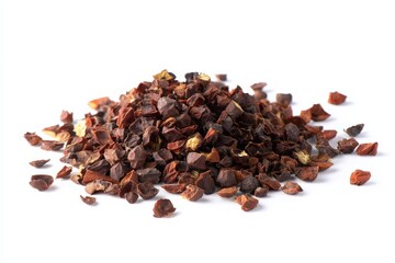Obraz premium A pile of dark brown, earthy-toned spice sits on a white background.