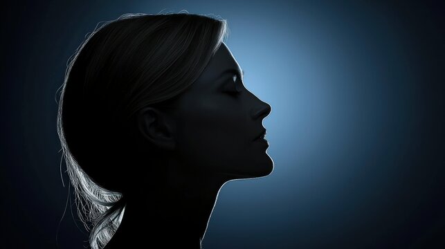 Woman's profile silhouette on a gradient dark background