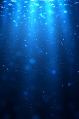 Obraz premium Underwater light beams, particles, dark blue