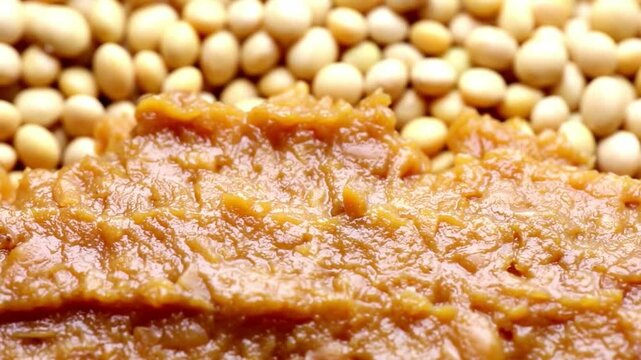 Close-up of Miso Paste with Soybeans Background