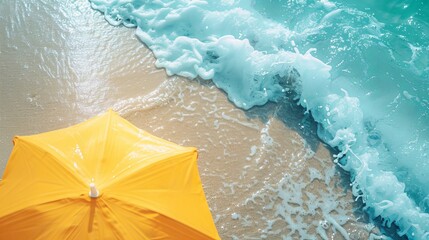 Fototapeta premium retro summer beach scene with umbrella and waves teal and yellow on umbrella .
