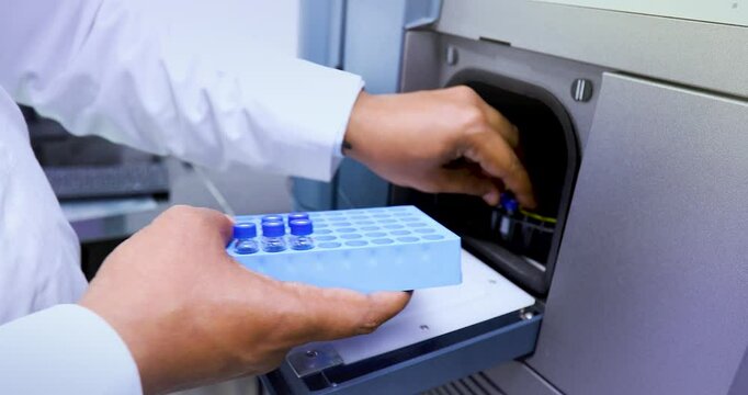 hplc science experiment Vials filling inside an autosampler of an HPLC machine inside view in a Scientific experimental laboratory for research development analysis and ipqa test study	
