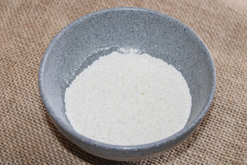 A bowl of flour. ingredients for making bread