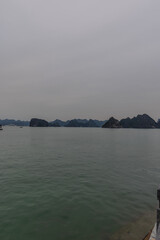 Halong Ha Long Bay Hanoi this Vietnamese wonder is littered with mountains and Rock cliffs popping out of the ocean, lush green mountains in Vietnam