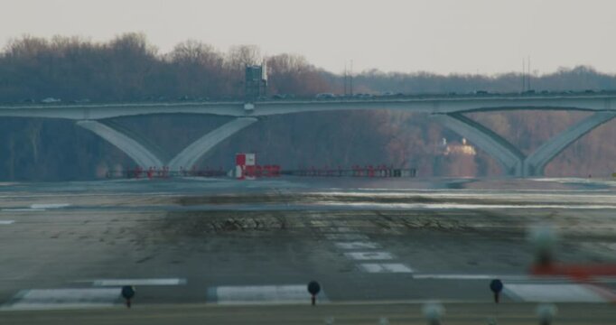 Passenger Jet Touching Down on Runway in the Early Evening