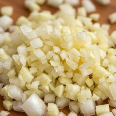 Closeup of Diced White Onions on Wooden Board