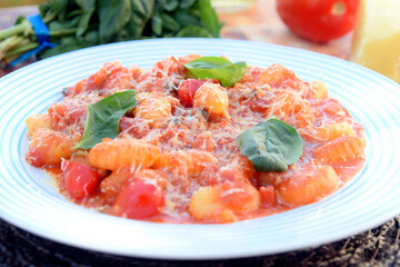 Gnocchi with red Bolognese sauce, typical Italian pasta potato food taste