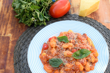 Gnocchi with red Bolognese sauce, typical Italian pasta potato food taste