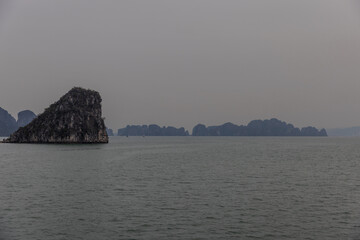 Halong Ha Long Bay Hanoi this Vietnamese wonder is littered with mountains and Rock cliffs popping out of the ocean, lush green mountains in Vietnam