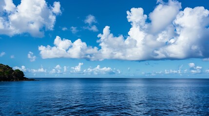 Obraz premium Vast Blue Ocean Under Bright Sky With White Clouds And Distant Horizon