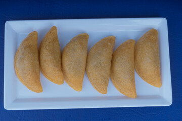 Delicious traditional Colombian empanadas with spicy sauce