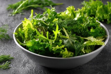 Fototapeta premium fresh salad greens mix in white bowl