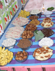 Sinhala and Hindu New Year table full of sweets. sri lanka new year traditional food table. south asian sweets food table for new year. aluth avurudu kema. Sinhala Tamil New Year Traditional Foods