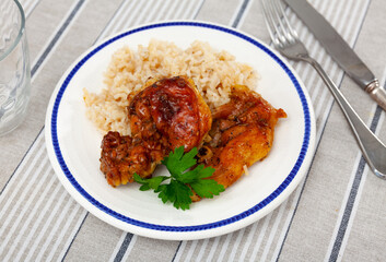 Delicious fried chicken pieces served with rice on plate