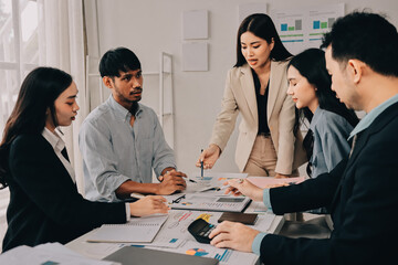 Team of financial advisory services. Asian advisor showing plan of investment to clients in the consultancy office..