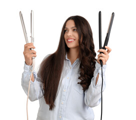 Pretty young woman with hair straighteners on white background