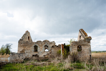 The magnificent weathered ruins stand tall, surrounded by the lush embrace of nature, reflecting a...