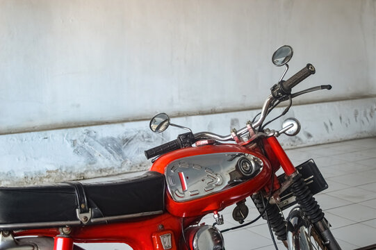 an old classic red Honda S90Z motorbike, Indonesia, 2 October 2023.
