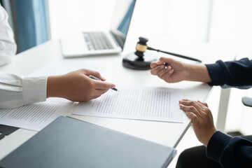 Lawyer businessman working&nbsp;with lawbook in office&nbsp;or courtroom Legal counsel with gavel and legal law. justice and lawyer concept Judge gavel hammer on Lawyer desk.